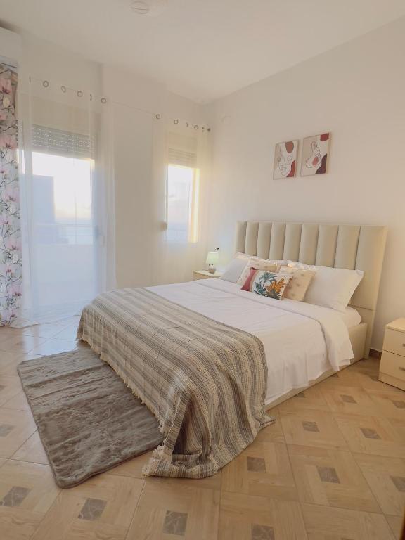 Postel nebo postele na pokoji v ubytování LunaSol seaside Apartments
