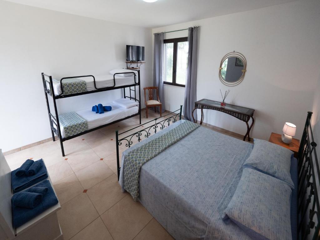 Postel nebo postele na pokoji v ubytování Agriturismo Twin Tails - Sant'Isidoro