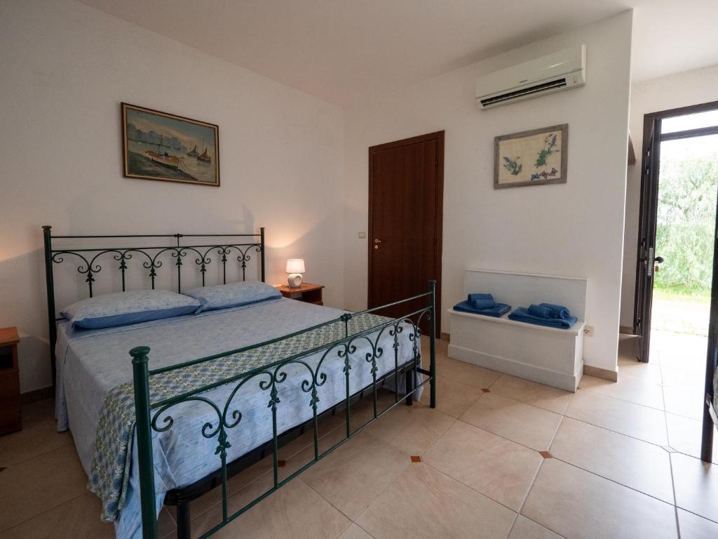 Postel nebo postele na pokoji v ubytování Agriturismo Twin Tails - Sant'Isidoro