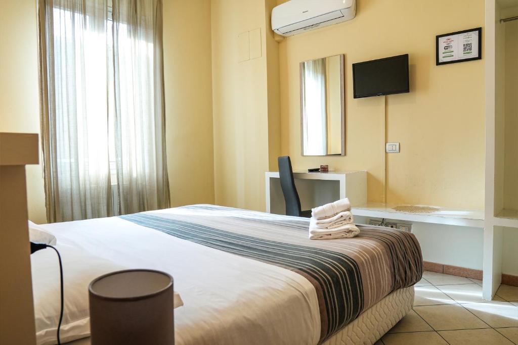 Postel nebo postele na pokoji v ubytování SMART HOTEL