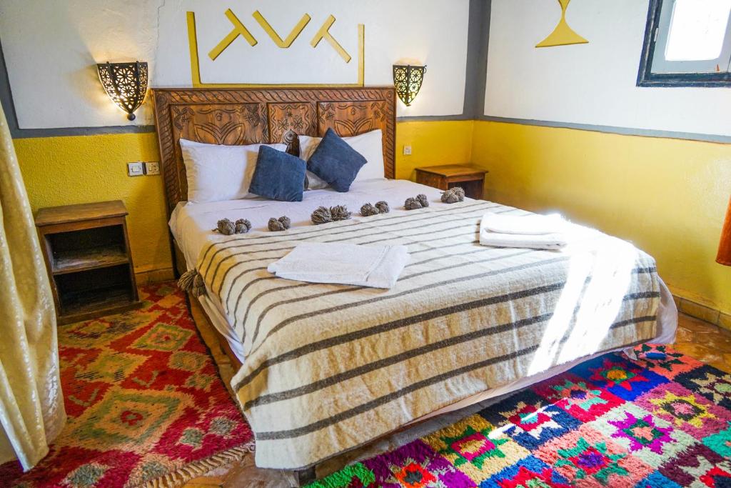 Postel nebo postele na pokoji v ubytování Kasbah Erg Chebbi