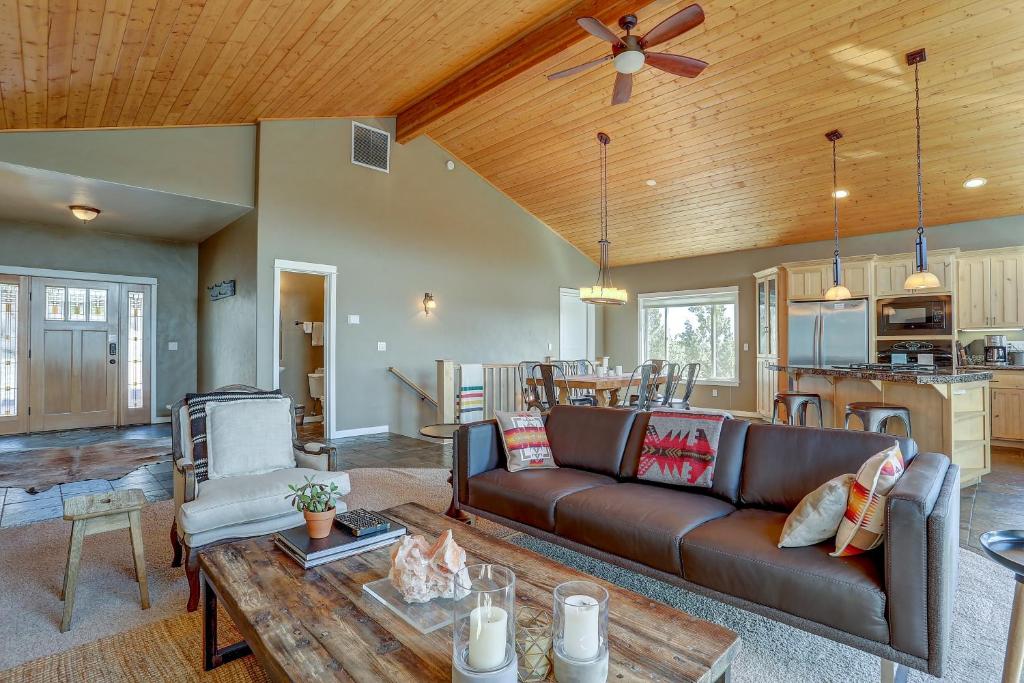 a living room with a couch and a table at Golden Butte in Bend
