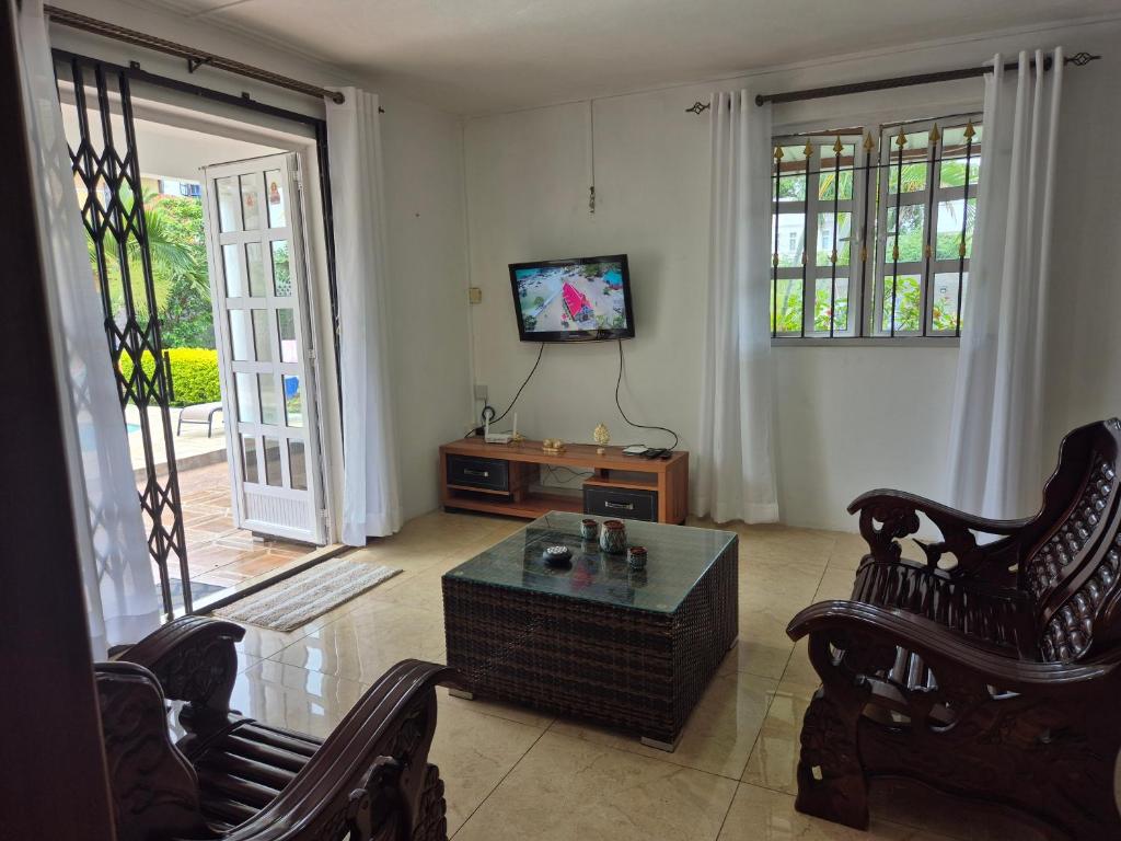 TV a/nebo společenská místnost v ubytování Villa Sunset Mauritius