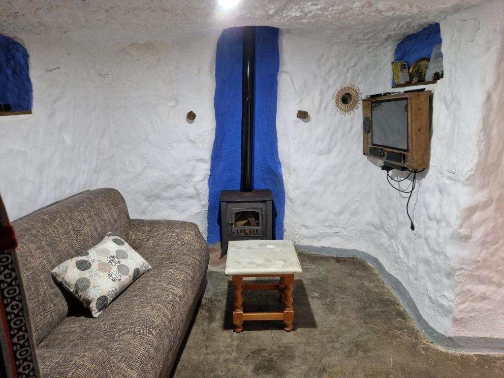 TV a/nebo společenská místnost v ubytování Cueva de David