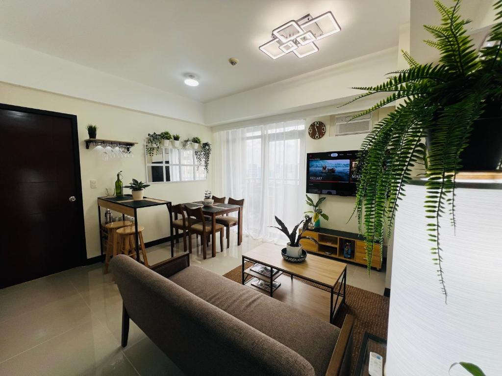 TV a/nebo společenská místnost v ubytování Casa Tagpuan at Manhattan Heights
