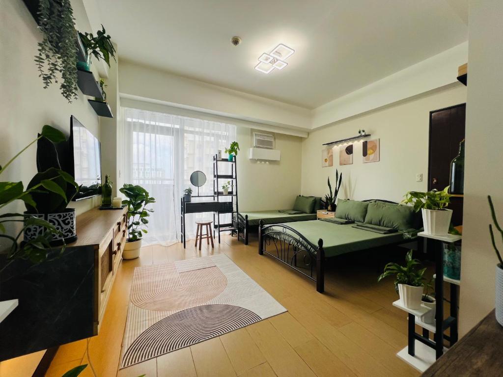Postel nebo postele na pokoji v ubytování Casa Tagpuan at Manhattan Heights