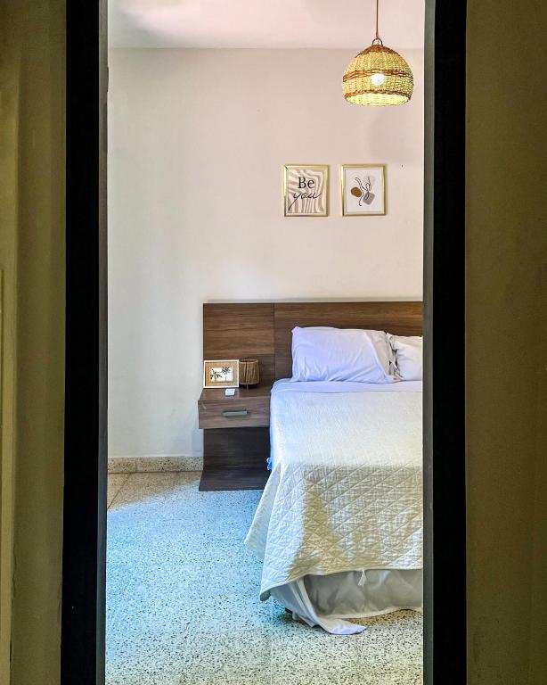 Postel nebo postele na pokoji v ubytování Hotel Herrera