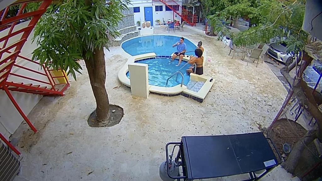 a group of people playing in a swimming pool at VILLAS SONJASAA LOFt in Baní