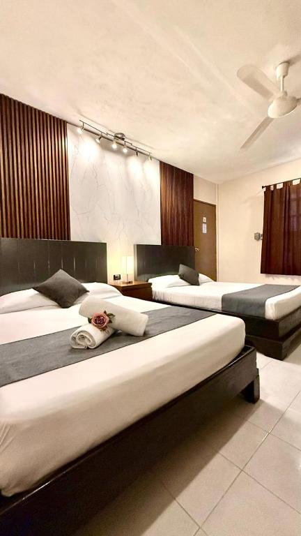 Ένα ή περισσότερα κρεβάτια σε δωμάτιο στο Hotel Baroni