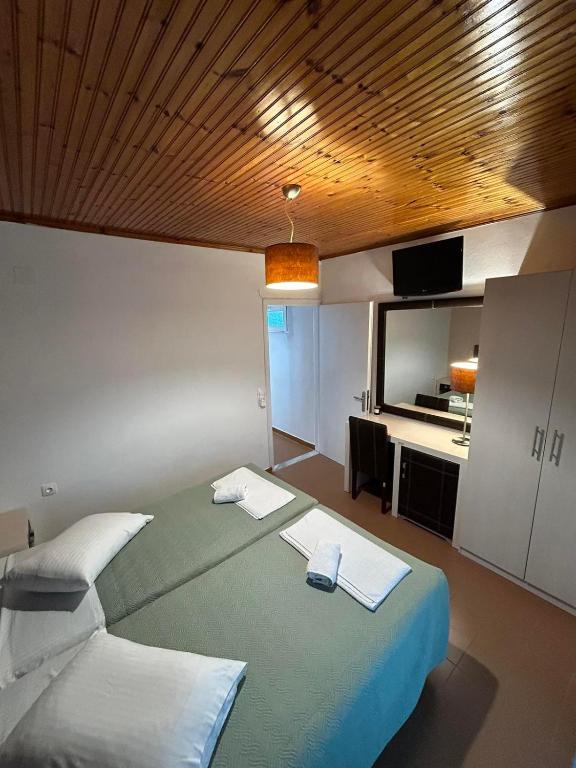Postel nebo postele na pokoji v ubytování Christodoulos Apartment