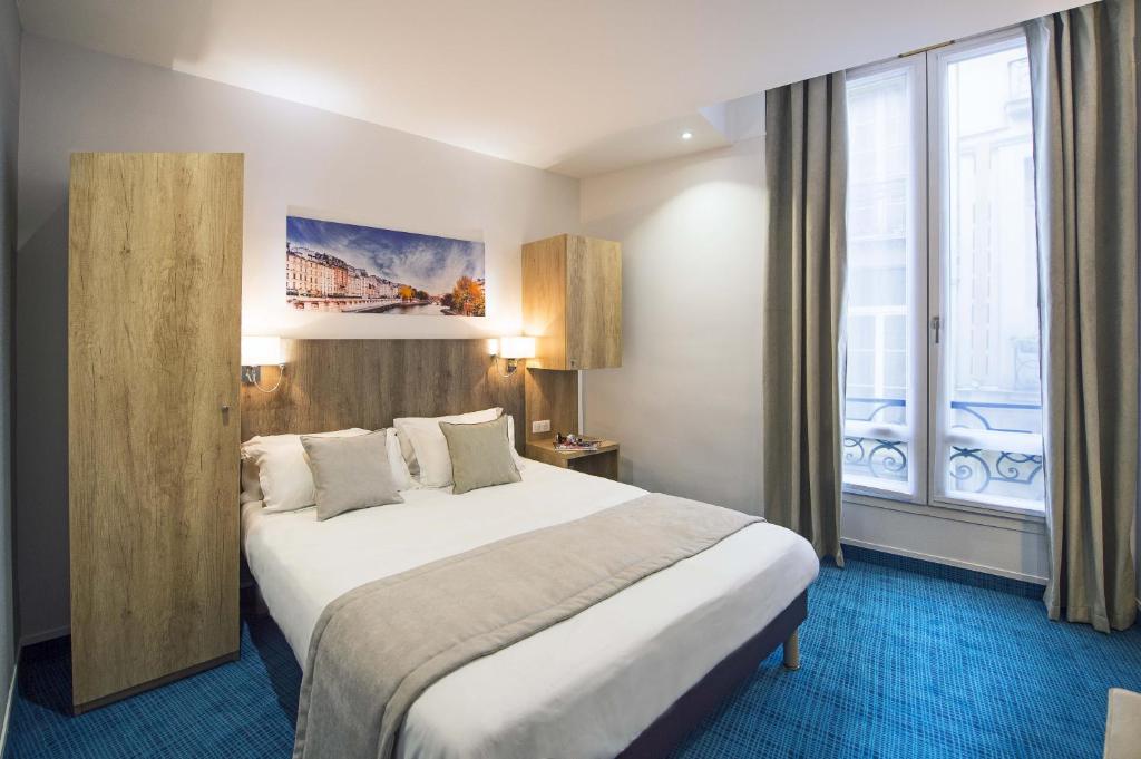 Cama o camas de una habitación en Hôtel Eugénie