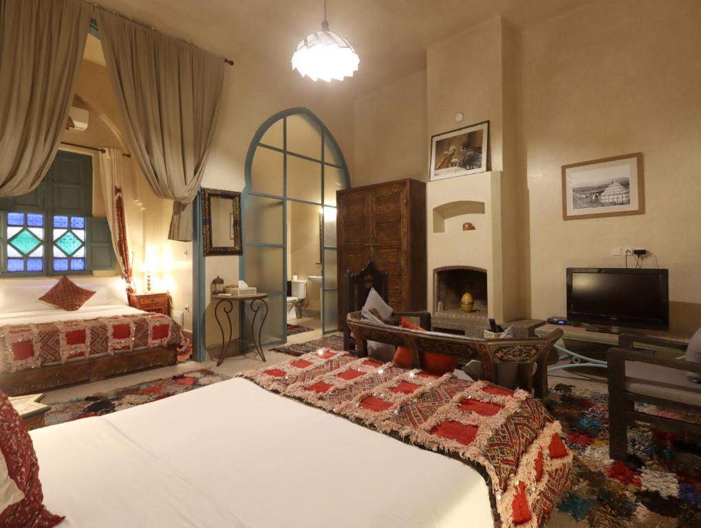 Postel nebo postele na pokoji v ubytování Riad Villa Elgada