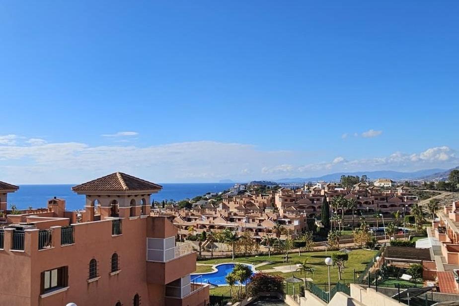 a view of a city from a building at Ático con vistas al Mediterráneo in Isla Plana