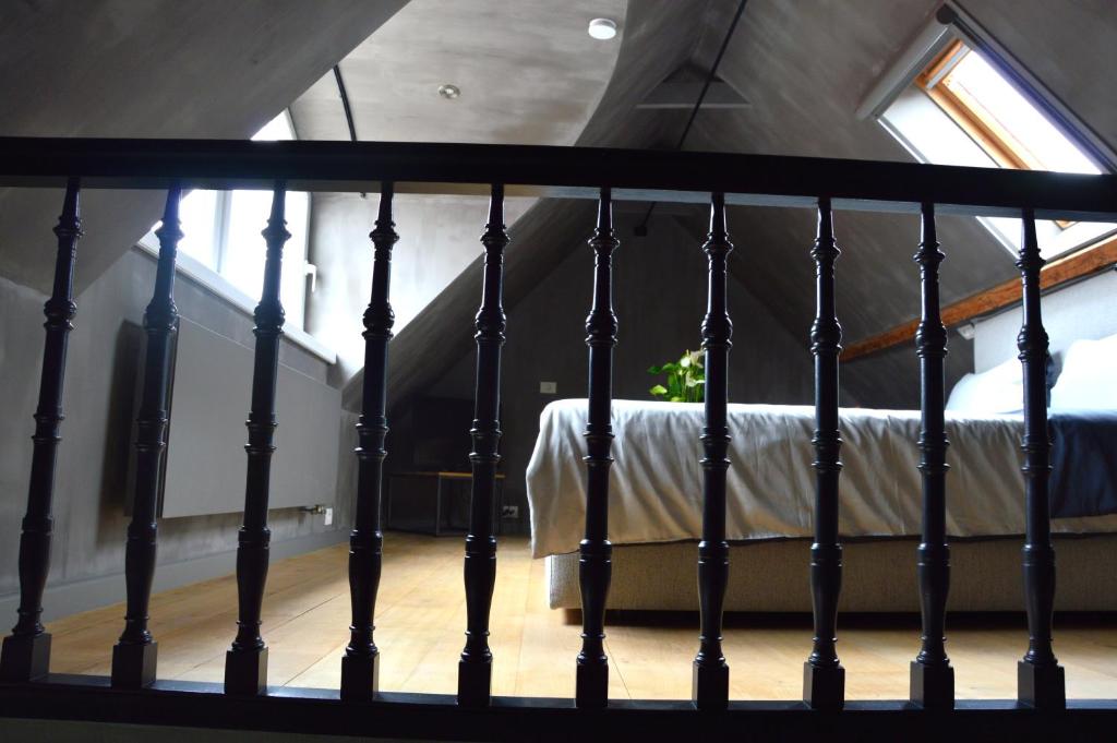 A bed or beds in a room at Amato-Brugge