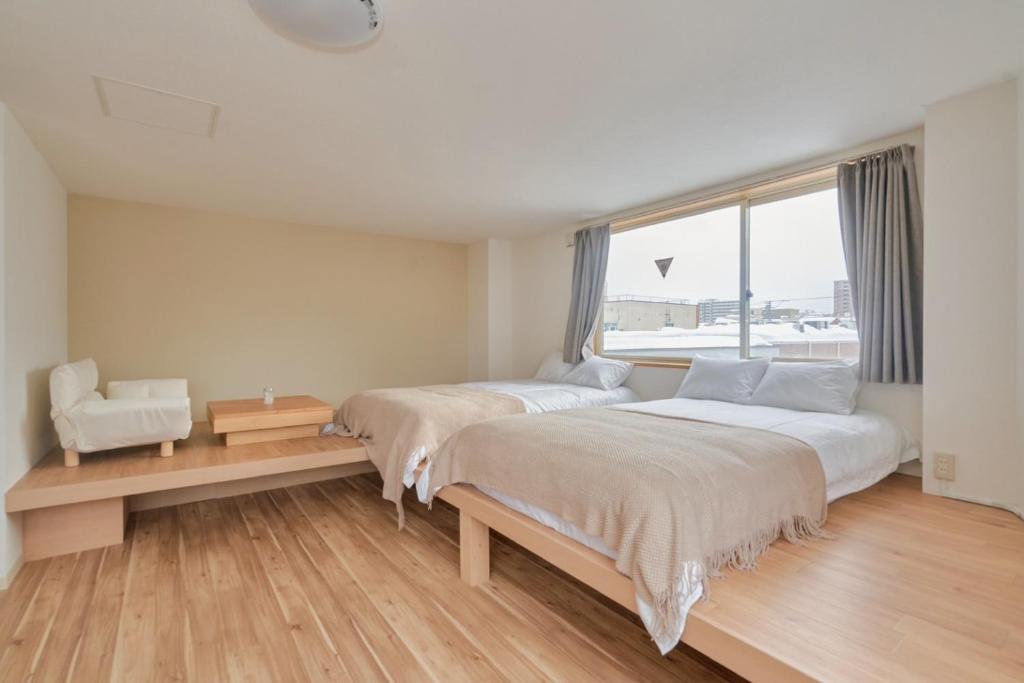 Ένα ή περισσότερα κρεβάτια σε δωμάτιο στο The Stay 細雪