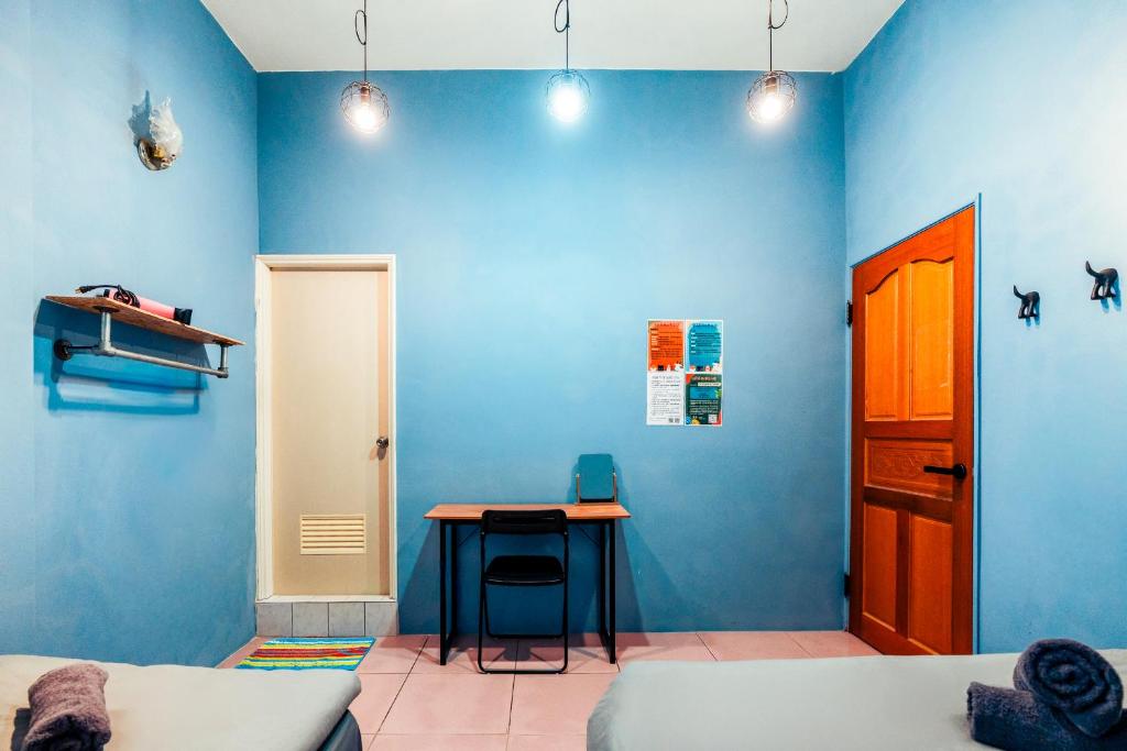 Postel nebo postele na pokoji v ubytování Green Island Ocean Rhythem dive B&B 綠島海韻民宿
