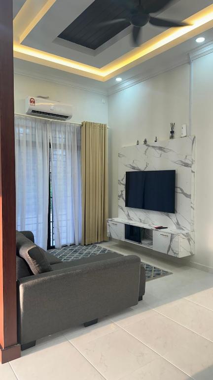 TV a/nebo společenská místnost v ubytování iDesa Homestay