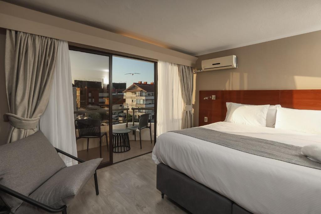Postel nebo postele na pokoji v ubytování Mahia hotel Reñaca