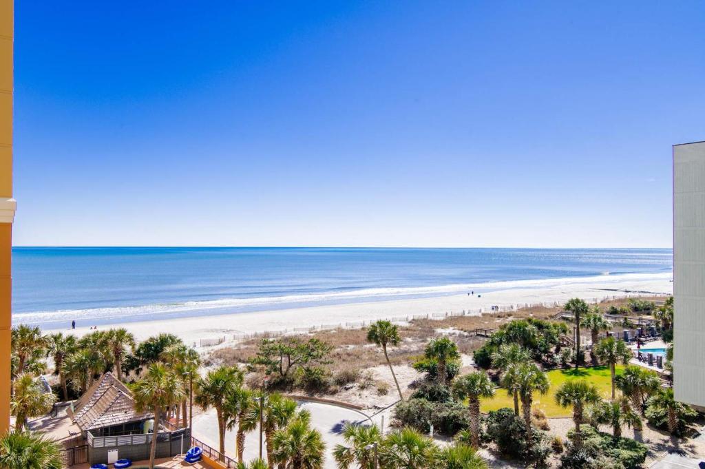 a view of the beach from the balcony of a condo at Cool Coast Ocean View Resort Studio in Myrtle Beach