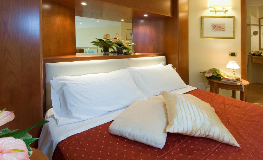 Postel nebo postele na pokoji v ubytování AS Hotel Monza