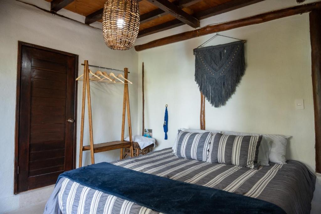 Postel nebo postele na pokoji v ubytování BAAWE Bacalar