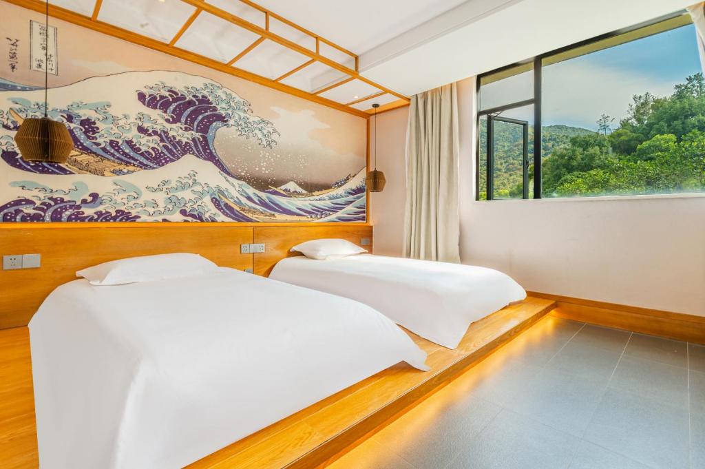 Letto o letti in una camera di Shenzhen Yusu Linting Seaview Inn Judiaosha Branch