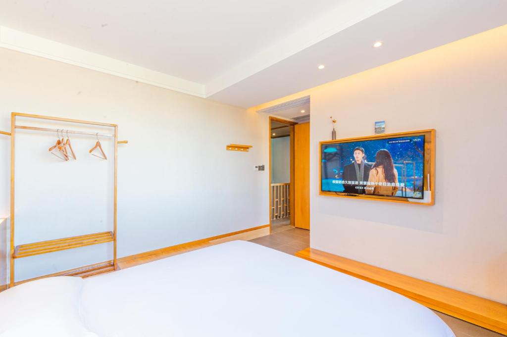 TV o dispositivi per l'intrattenimento presso Shenzhen Yusu Linting Seaview Inn Judiaosha Branch