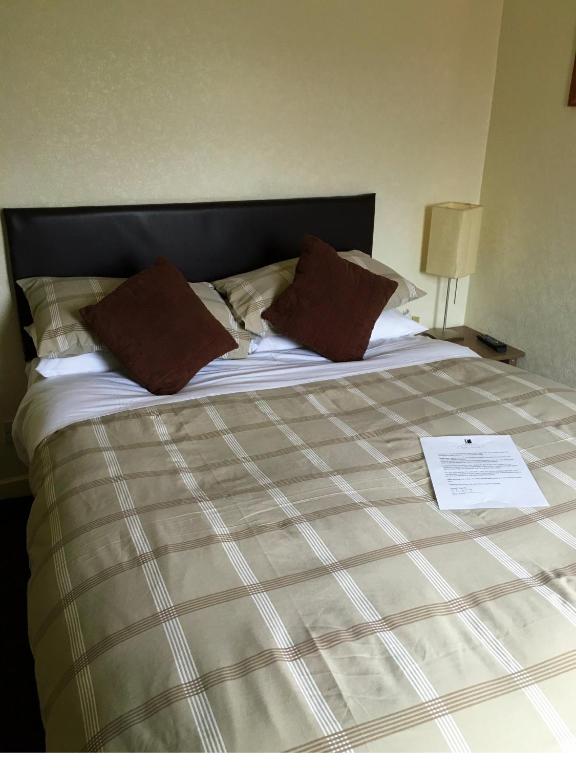 Postel nebo postele na pokoji v ubytování Redbeck Motel