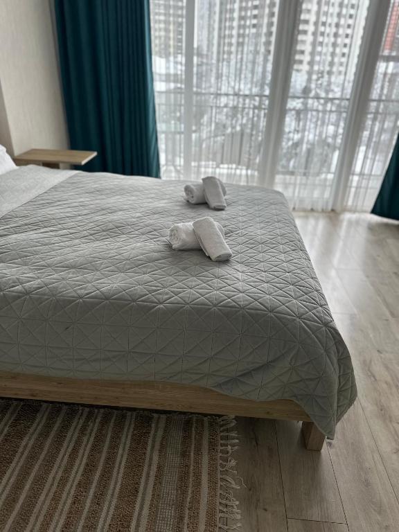 Postel nebo postele na pokoji v ubytování Orange Batumi Travel