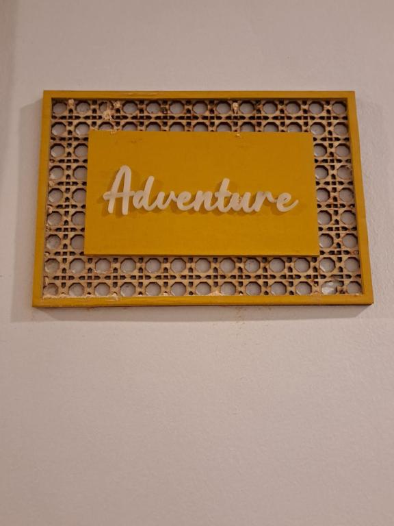 a sign for an appliance on a wall at The Haven Hostel in Boracay