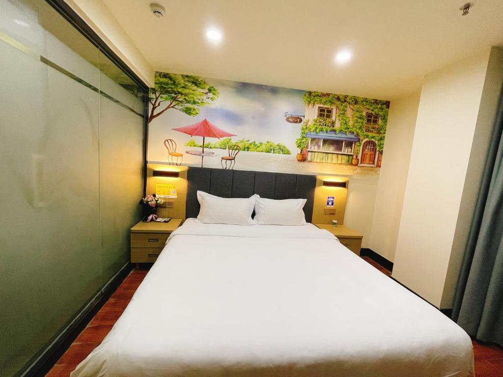 Postel nebo postele na pokoji v ubytování EMi Hotel Guangzhou International Convention and Exhibition Center Guangzhou Tower Branch