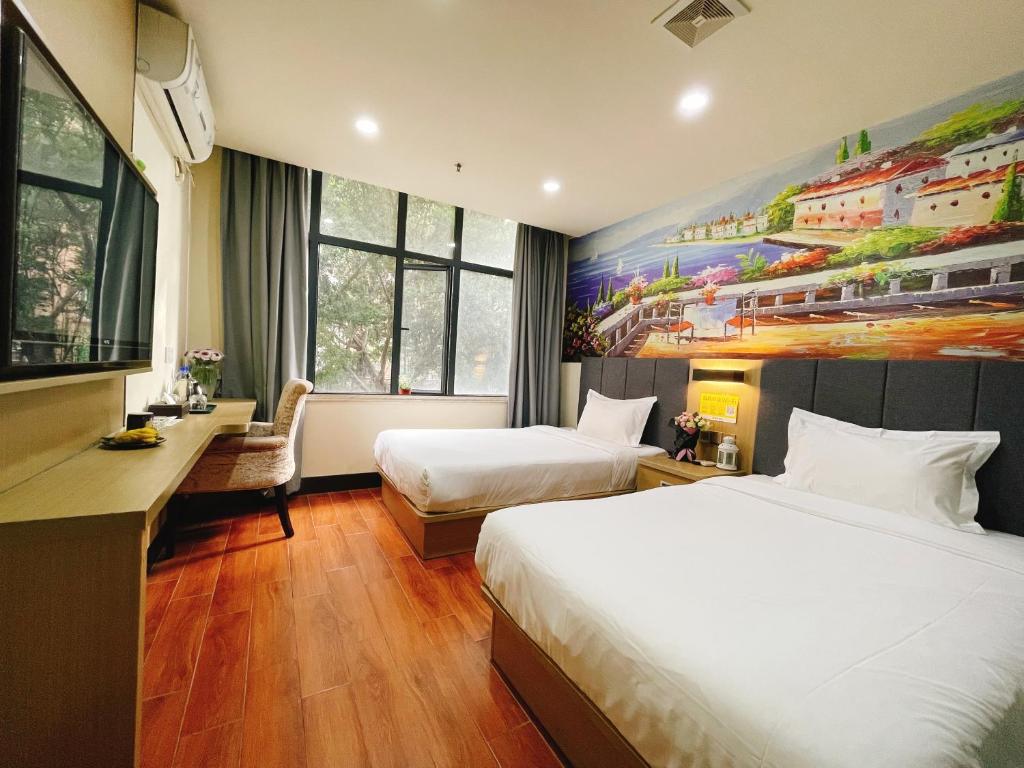 Postel nebo postele na pokoji v ubytování EMi Hotel Guangzhou International Convention and Exhibition Center Guangzhou Tower Branch