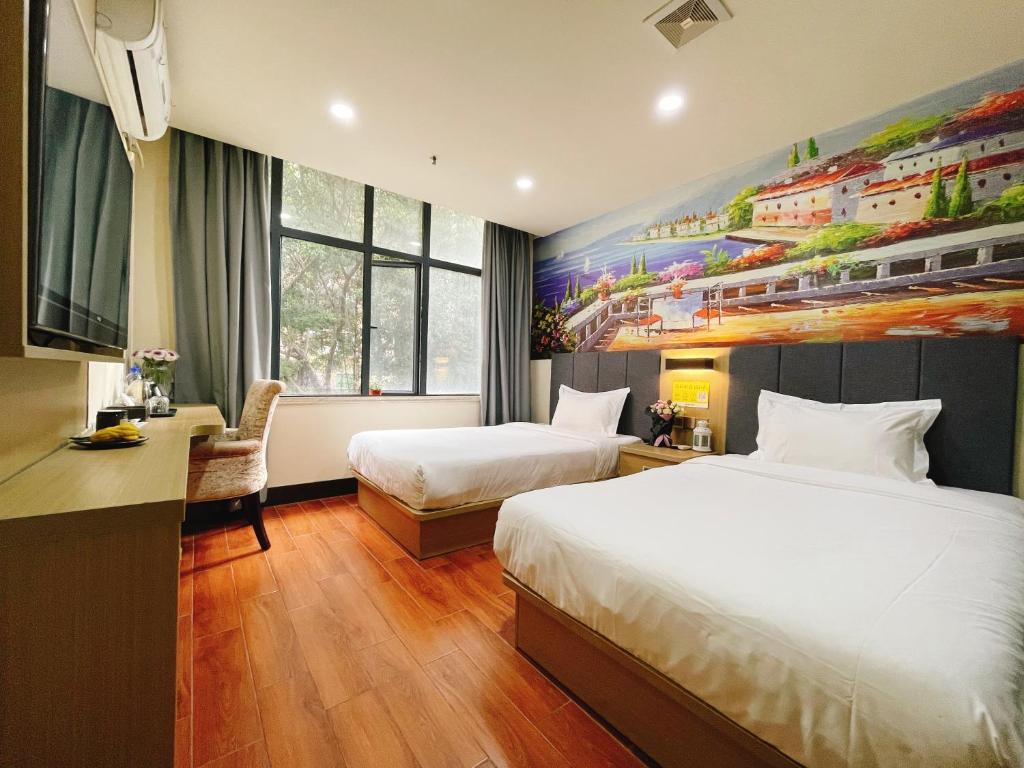 Postel nebo postele na pokoji v ubytování EMi Hotel Guangzhou International Convention and Exhibition Center Guangzhou Tower Branch