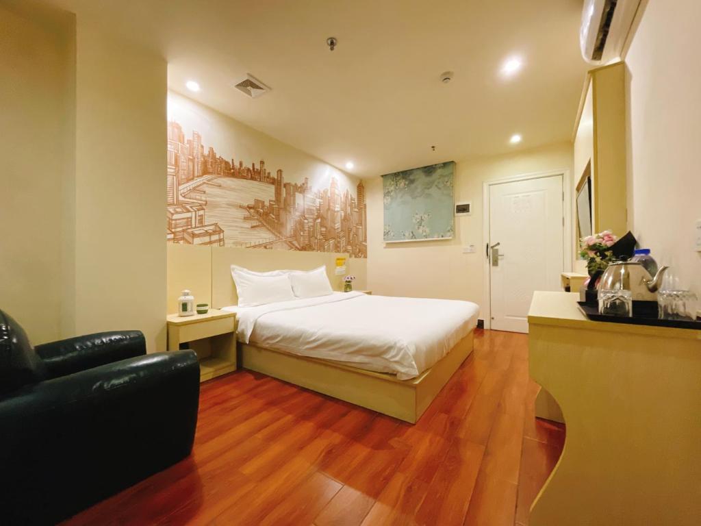 Postel nebo postele na pokoji v ubytování EMi Hotel Guangzhou International Convention and Exhibition Center Guangzhou Tower Branch