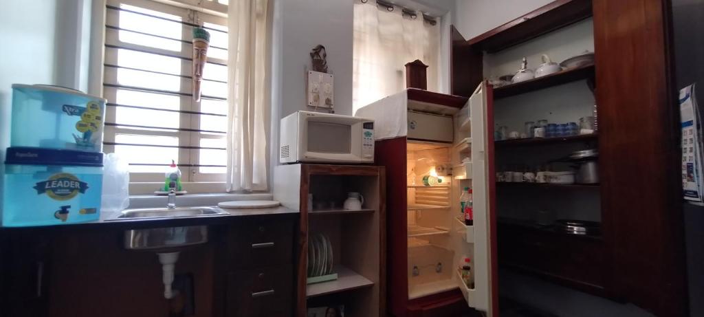 Kuchyň nebo kuchyňský kout v ubytování Madhav Bhavan Guest House