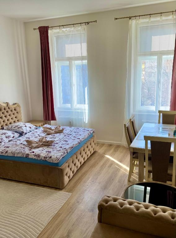 Postel nebo postele na pokoji v ubytování Apartmán Queen