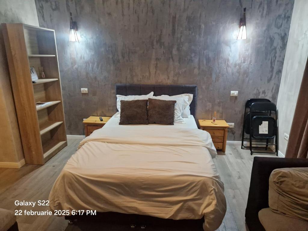 En eller flere senge i et værelse på Casa Rahova