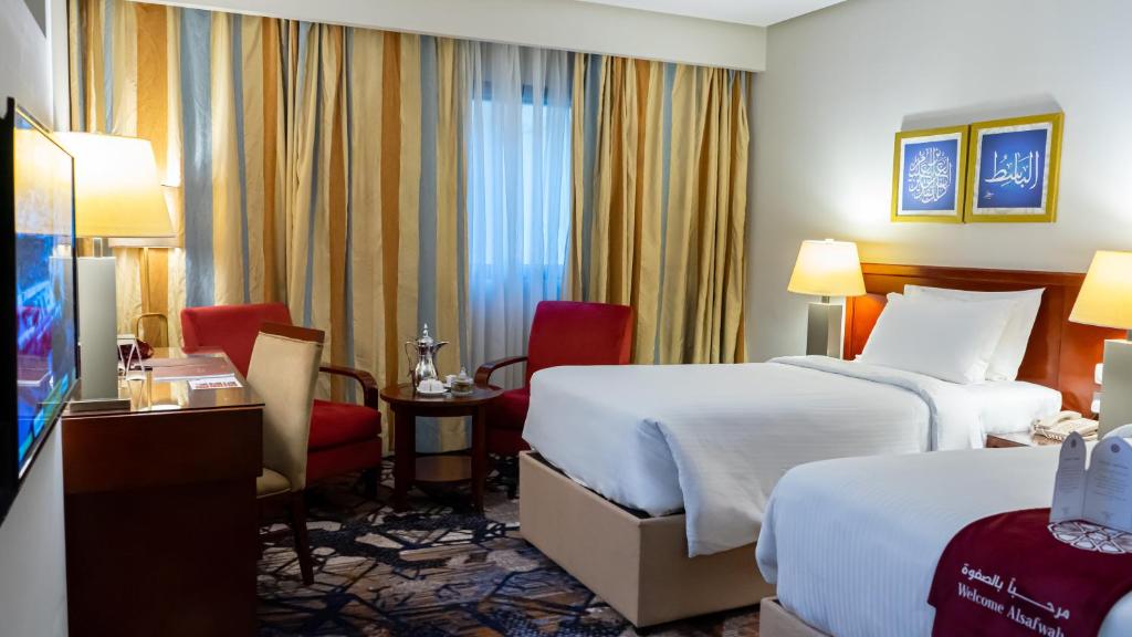 Postel nebo postele na pokoji v ubytování فندق الصفوة البرج الثالث Al Safwah Hotel Third Tower 3