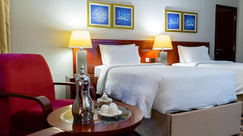 Postel nebo postele na pokoji v ubytování فندق الصفوة البرج الثالث Al Safwah Hotel Third Tower 3