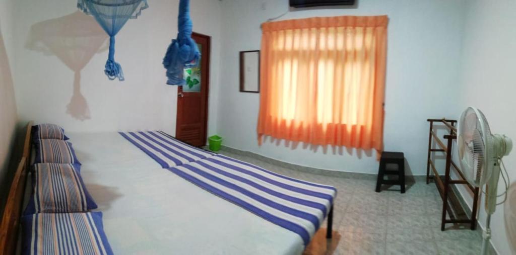 Postel nebo postele na pokoji v ubytování Didula Holiday Resort Anuradhapura