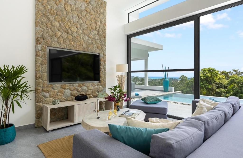TV a/nebo společenská místnost v ubytování VILLA CLARISSE - SEAVIEW - 4 Bedrooms