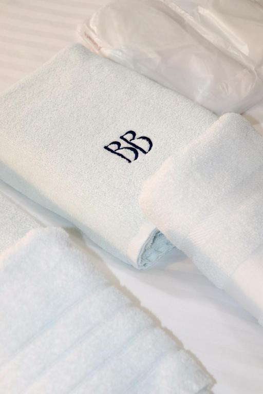 Postel nebo postele na pokoji v ubytování Blue Bottle Boutique Hotel