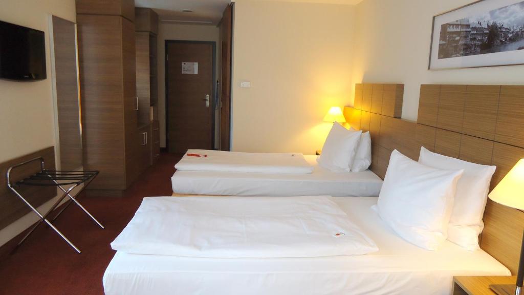 Postel nebo postele na pokoji v ubytování Best Western Hotel Bamberg