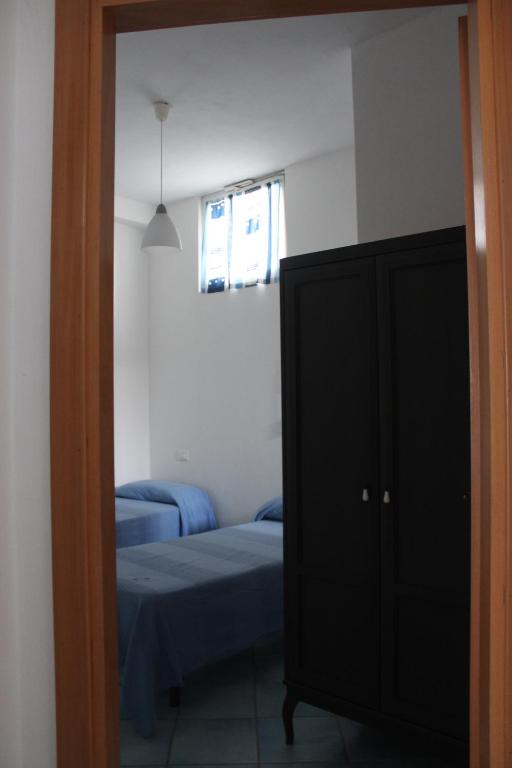 Postel nebo postele na pokoji v ubytování Arcadia Case e Vacanze