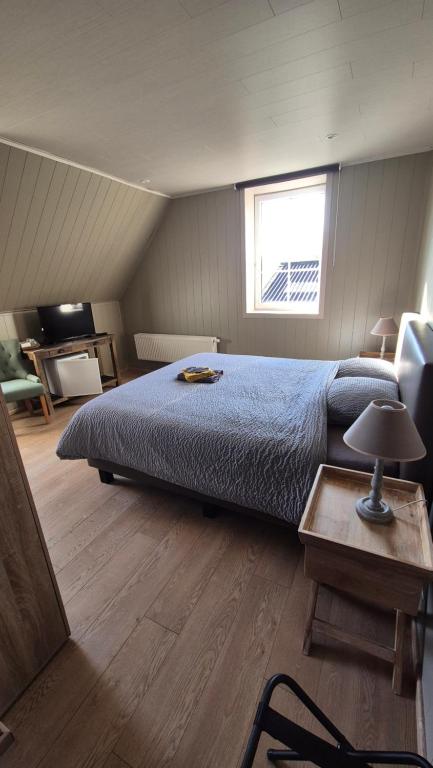 Postel nebo postele na pokoji v ubytování B&B De Dulle Koe