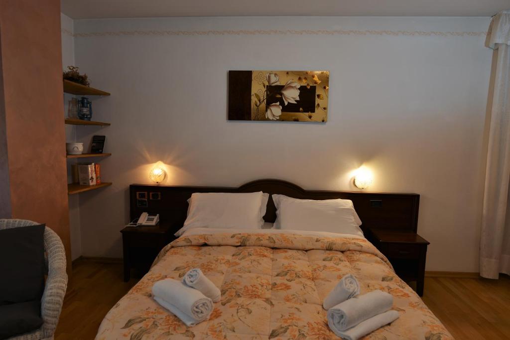 Postel nebo postele na pokoji v ubytování Hotel Marianna