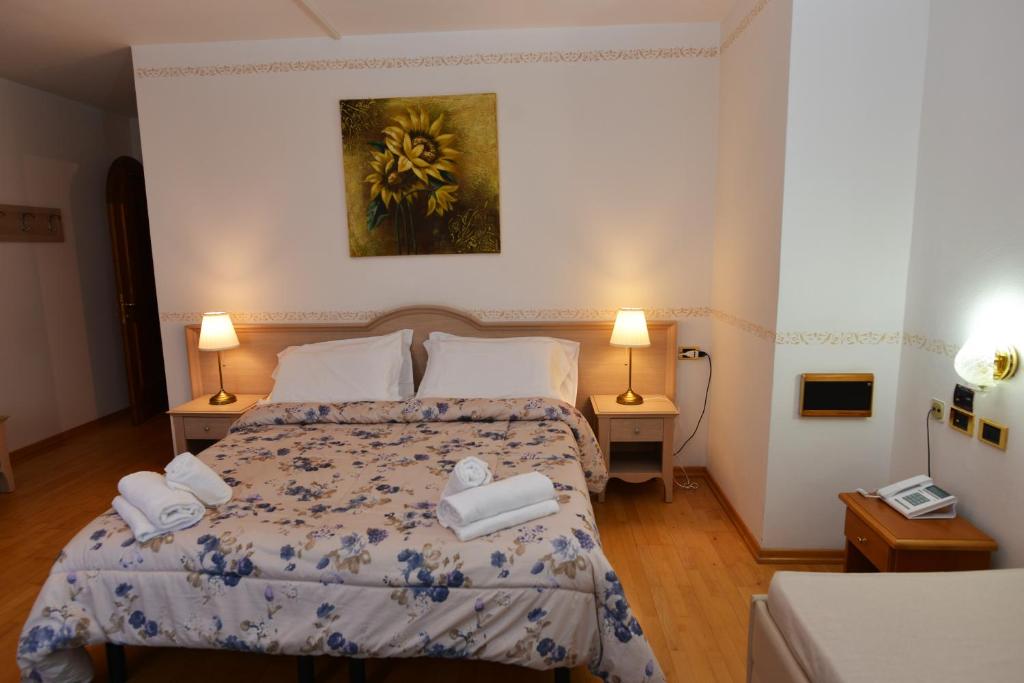 Postel nebo postele na pokoji v ubytování Hotel Marianna