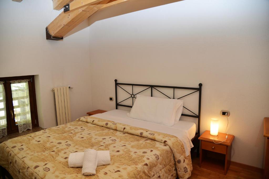 Postel nebo postele na pokoji v ubytování Hotel Marianna