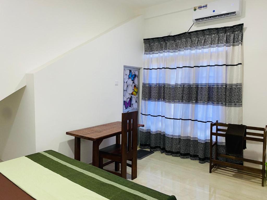 Postel nebo postele na pokoji v ubytování Mihitha Resort
