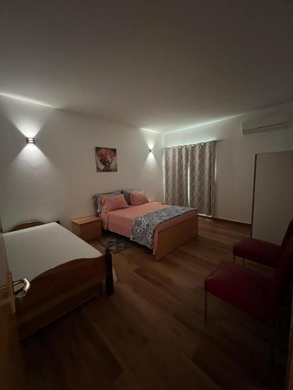 Postel nebo postele na pokoji v ubytování Residência Águia
